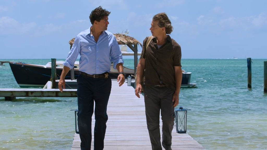John and Danny Rayburn walk on a dock at their mother's inn.