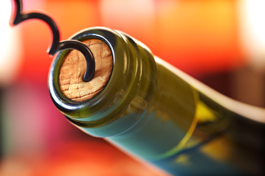 corkscrew opening a bottle of wine