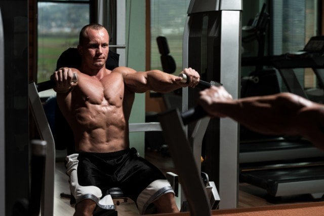 A man doing bench press for total-body workout