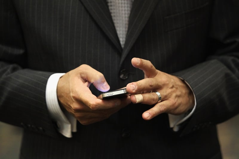 Man's hands on a smartphone. Man's hands on a smartphone.