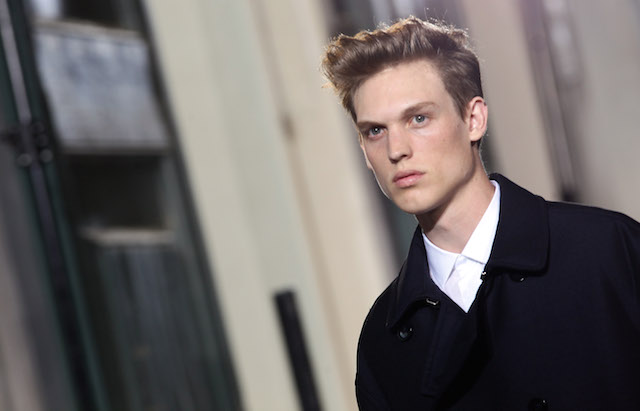 a model wearing black and white