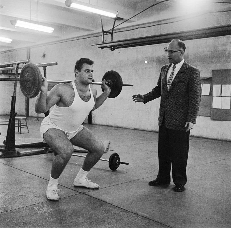 a man weight lifting a man weight lifting