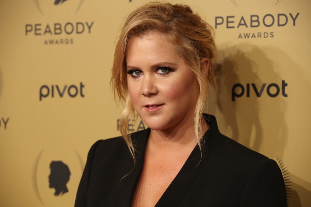 Amy Schumer poses forthecameras at an event