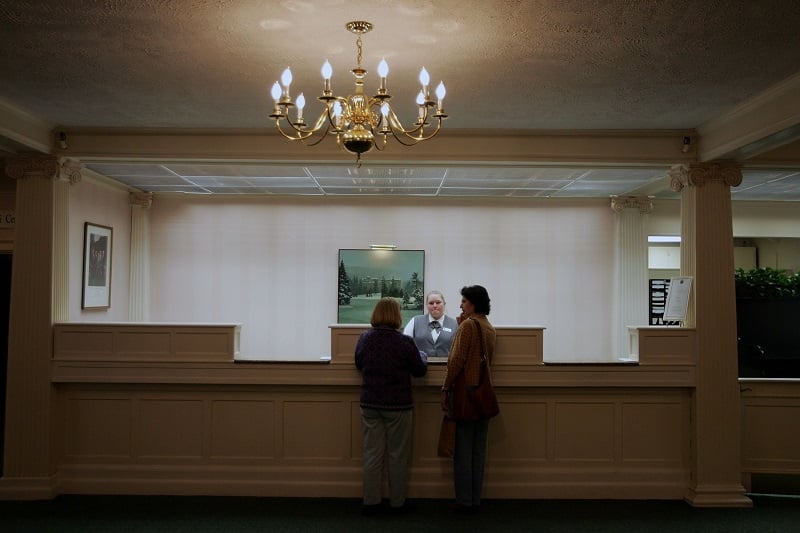 Woman at the front desk of a hotel