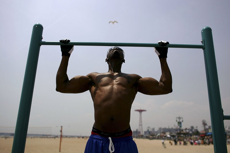 man doing pull-ups man doing pull-ups