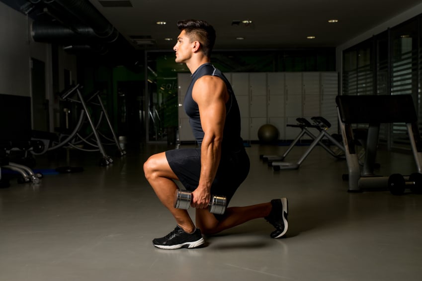 man doing a dumbbell lunge 