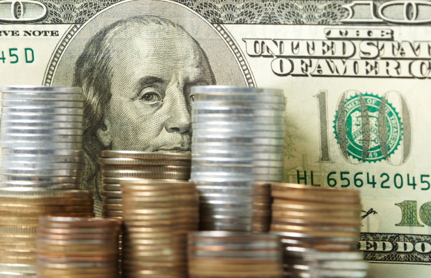 Cash and stacked coins