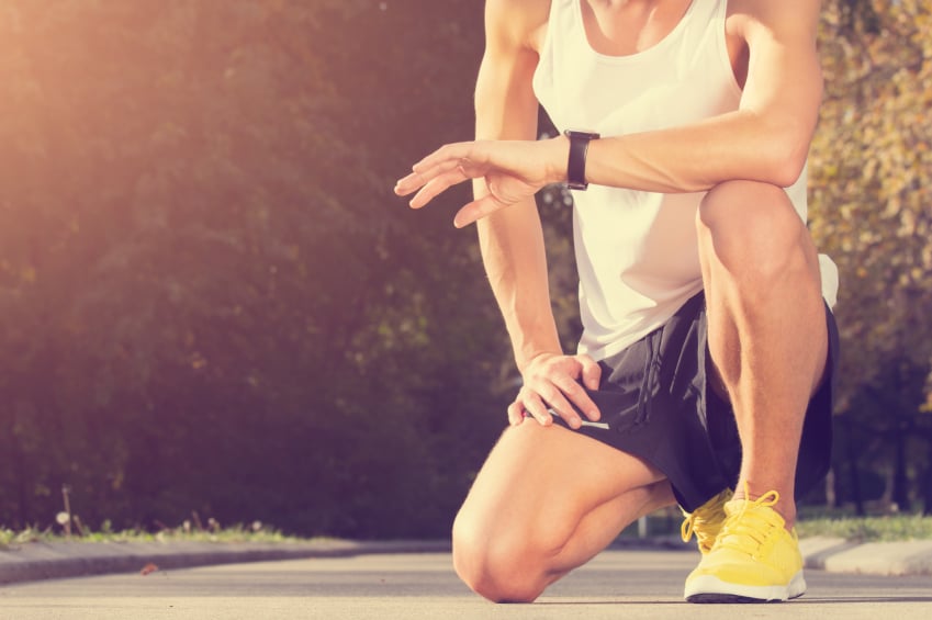 runner looking at watch