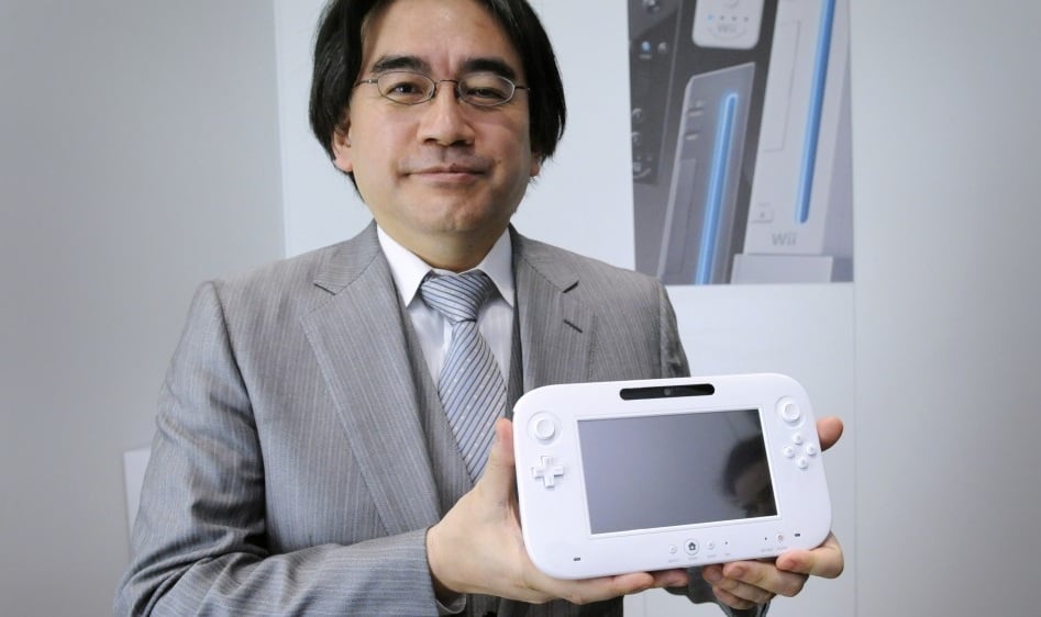 Satoru Iwata holds the Wii U