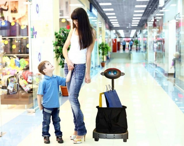 Budgee the Robot shopping with mom and son