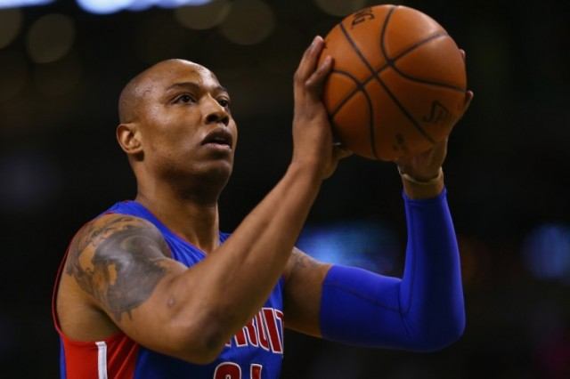 Caron Butler shooting a basketball into a hoop. Caron Butler shooting a basketball into a hoop.