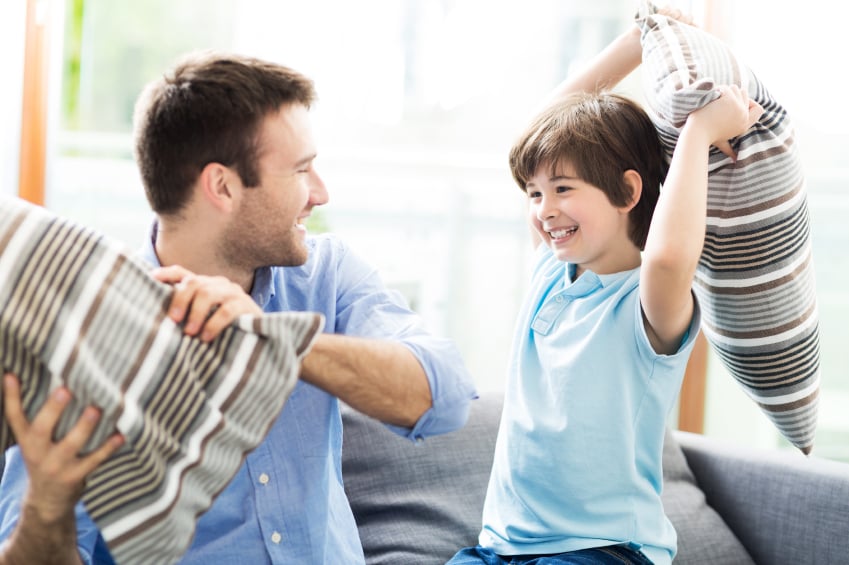 Father and son having pillow fight, dad, family