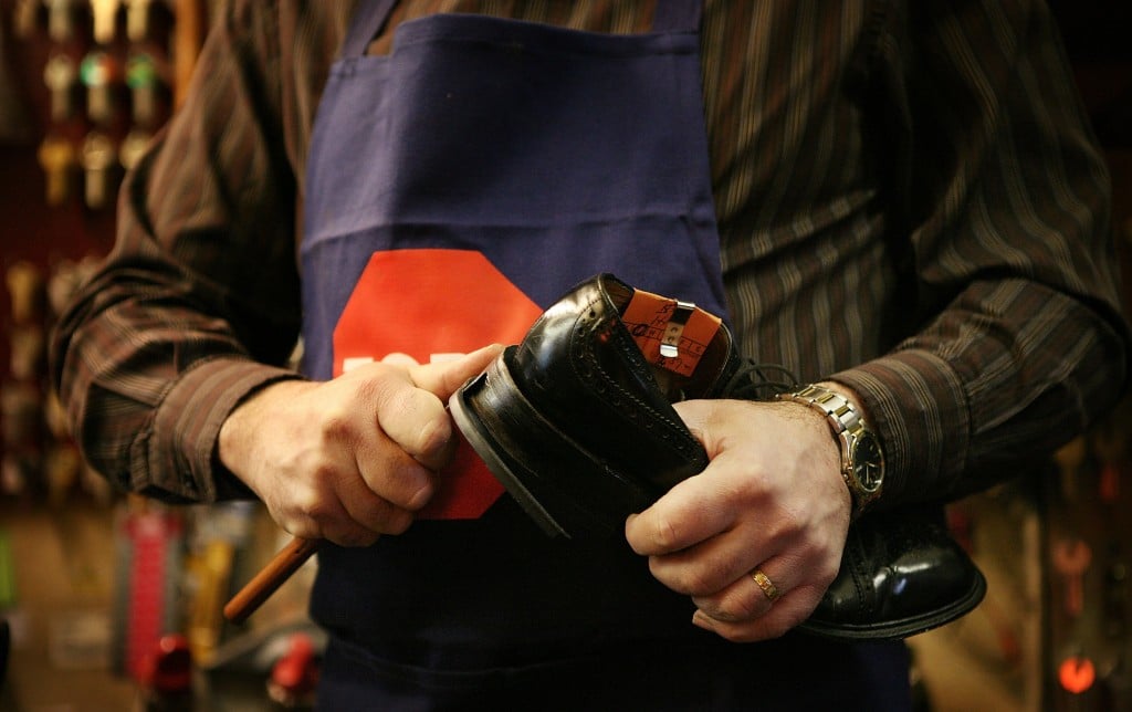 cobbler repairing shoe