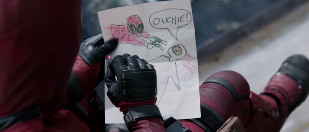 Deadpool drawing a doodle of himself fighting a villain. 