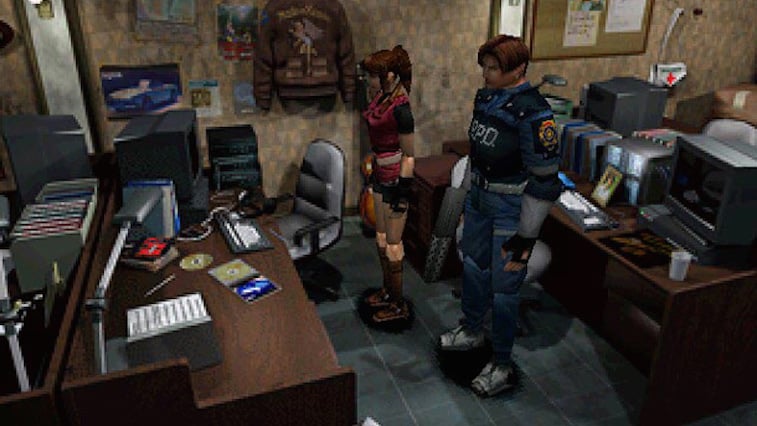 The two main characters of Resident Evil 2 inspect an office.