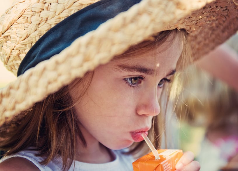 child drinking a juice box child drinking a juice box