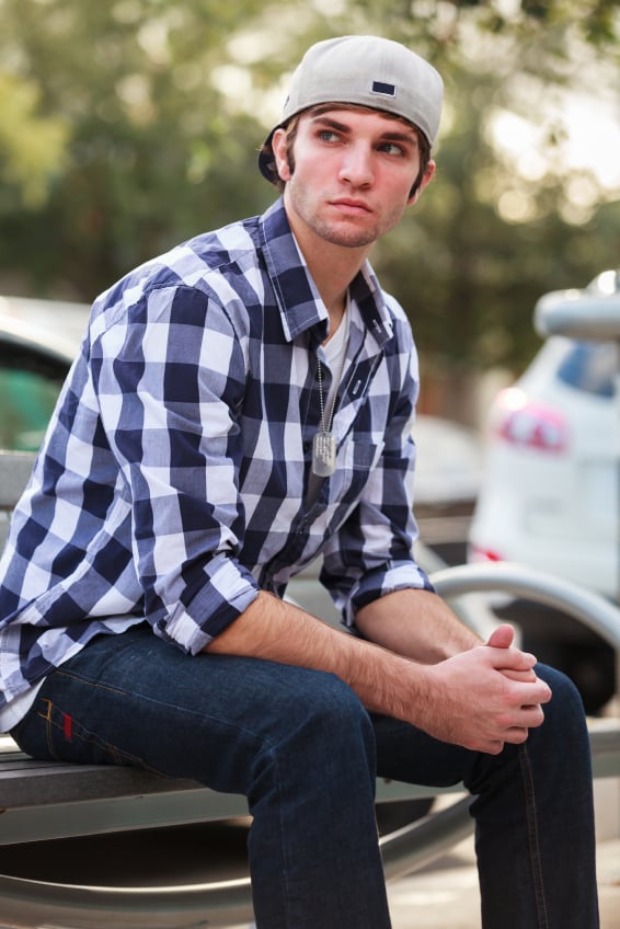 man in a hat and plaid shirt