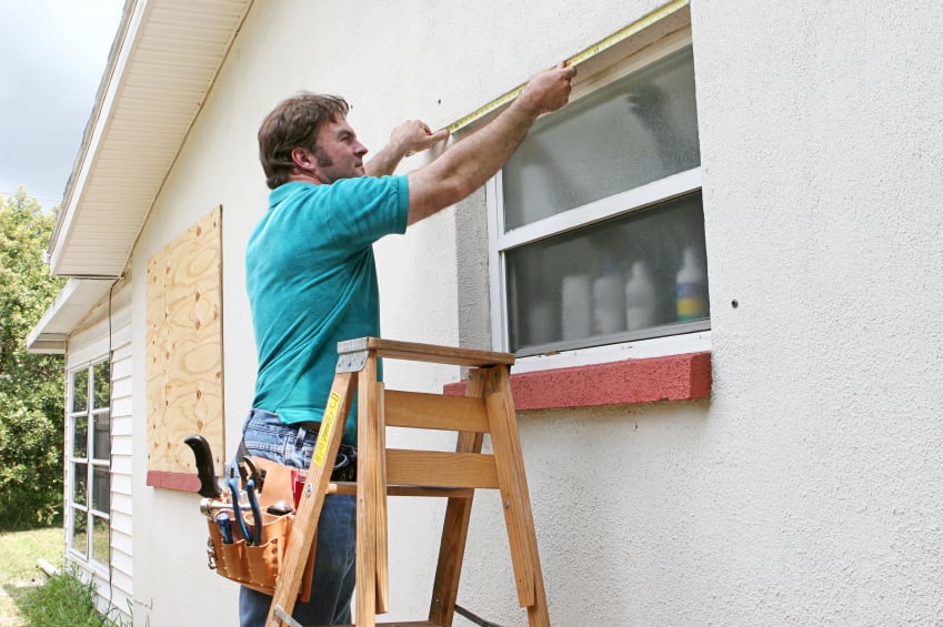 A man fixes a window