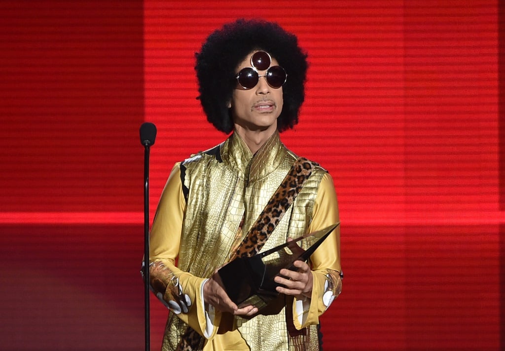 Prince accepts an award