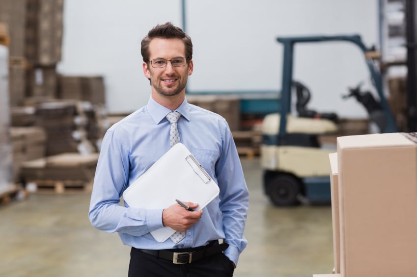 manager holding a clipboard