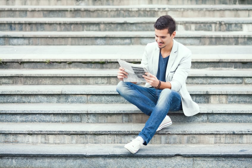 man reading newspaper