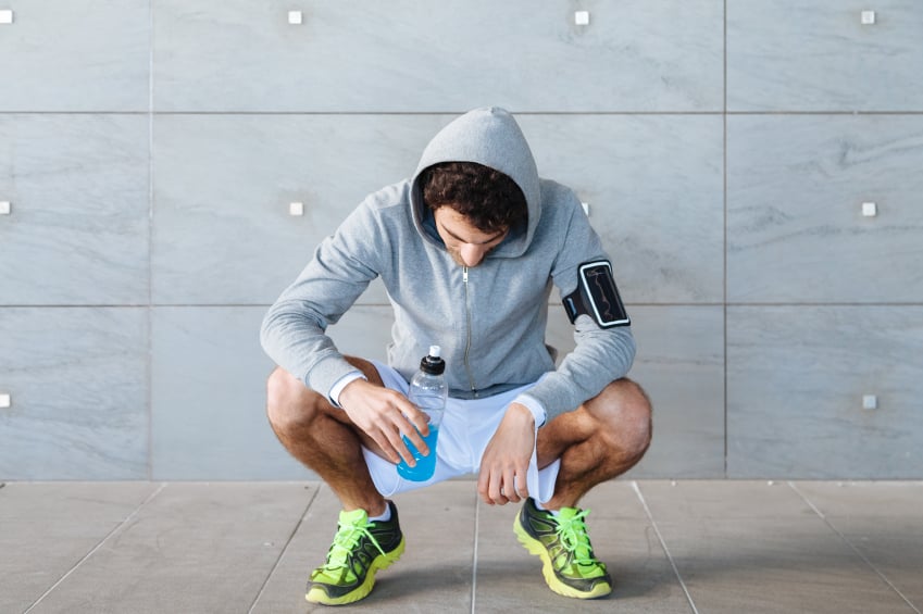 Young man resting on a run, sports drink, gatorade, exercise