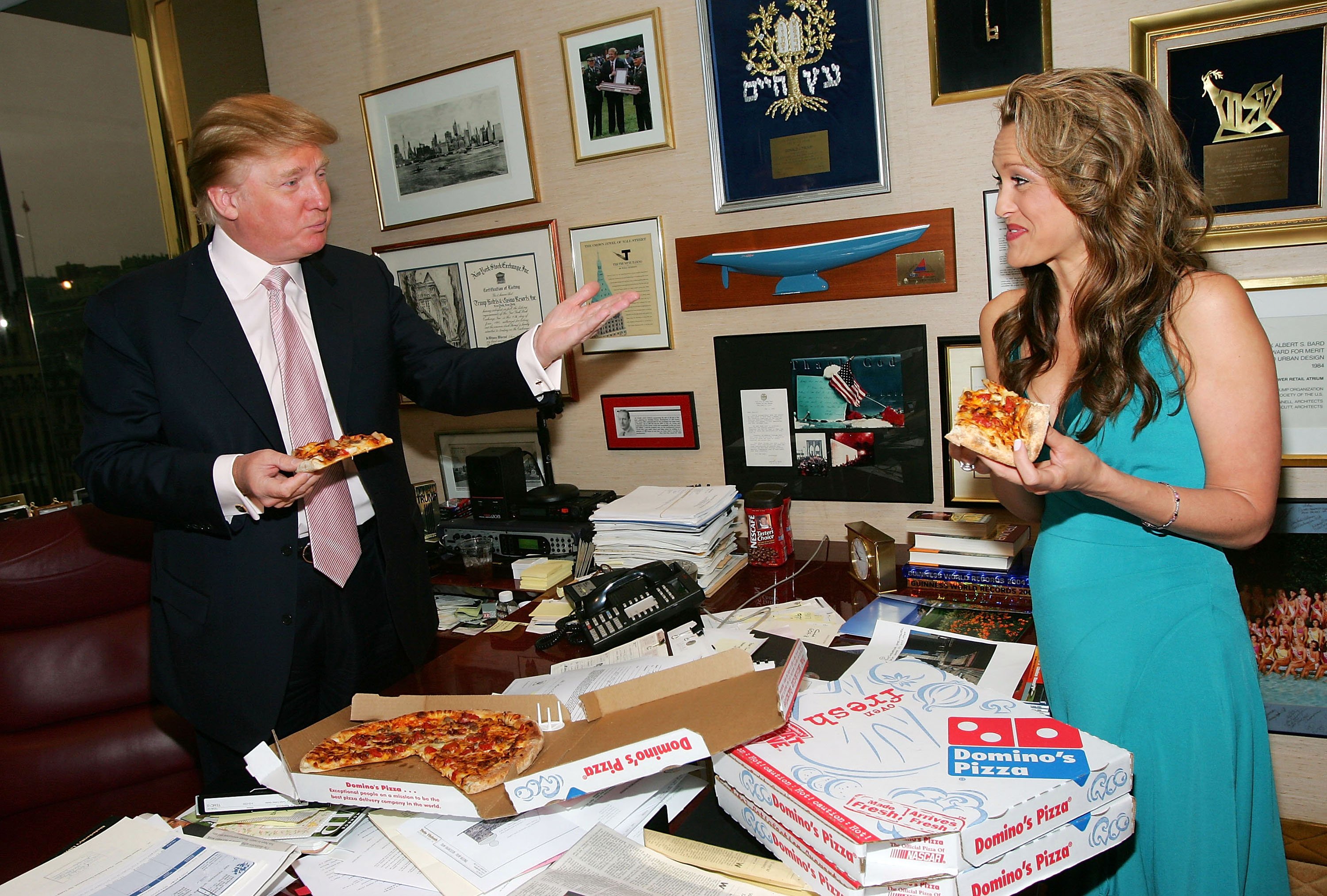 donald trump holding slice of pizza