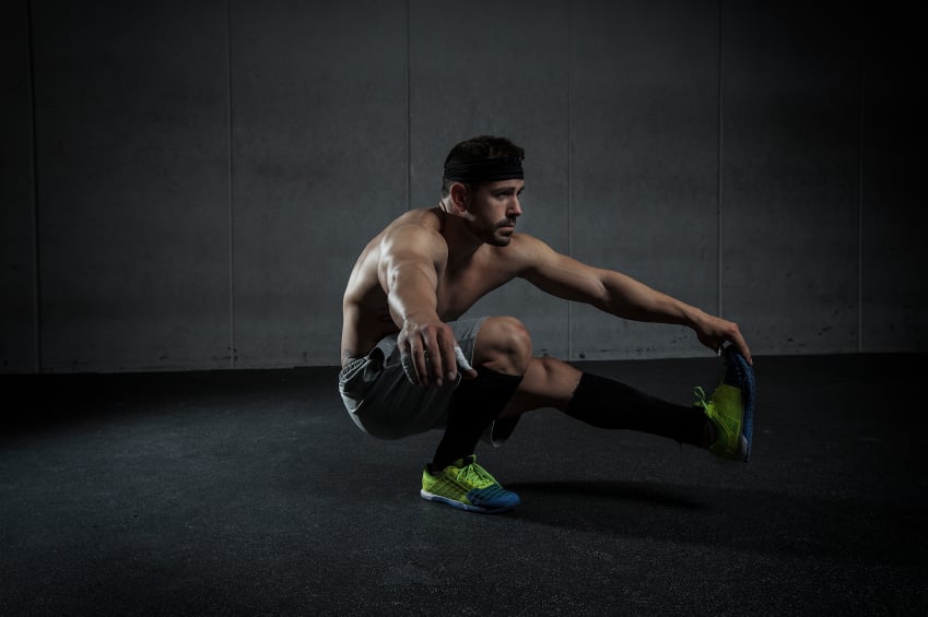 Man performing single-leg pistol squats Man performing single-leg pistol squats