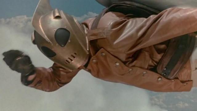 Billy Campbell as the Rocketeer wearing a mask and flying
