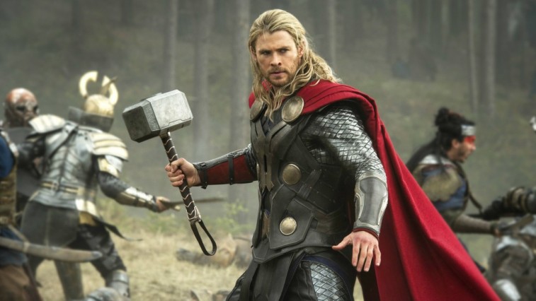 Thor holds up a hammer