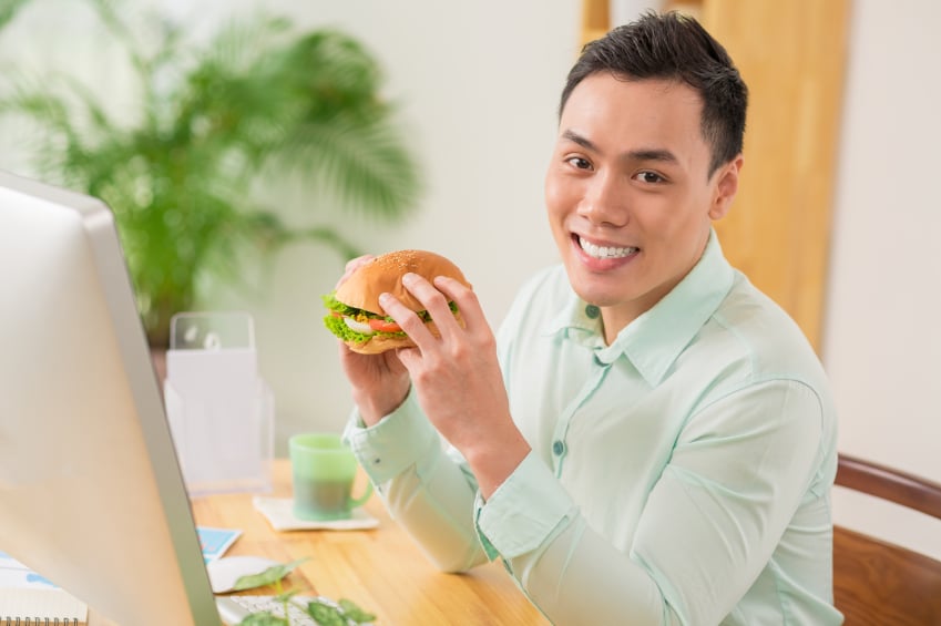 man eating burger
