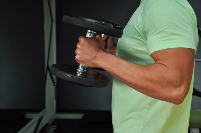 A man doing hammer curls with dumbbells A man doing hammer curls with dumbbells