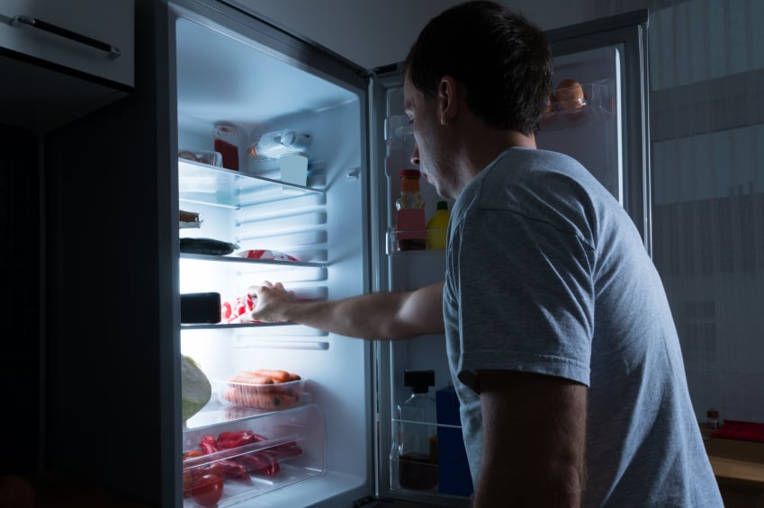 Man going for a late-night snack | iStock.com