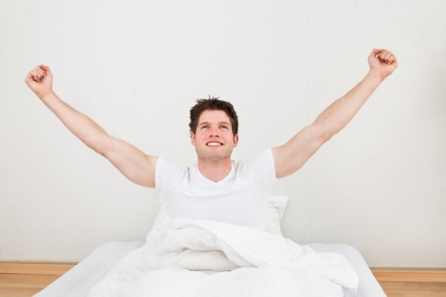 waking up and stretching in bed