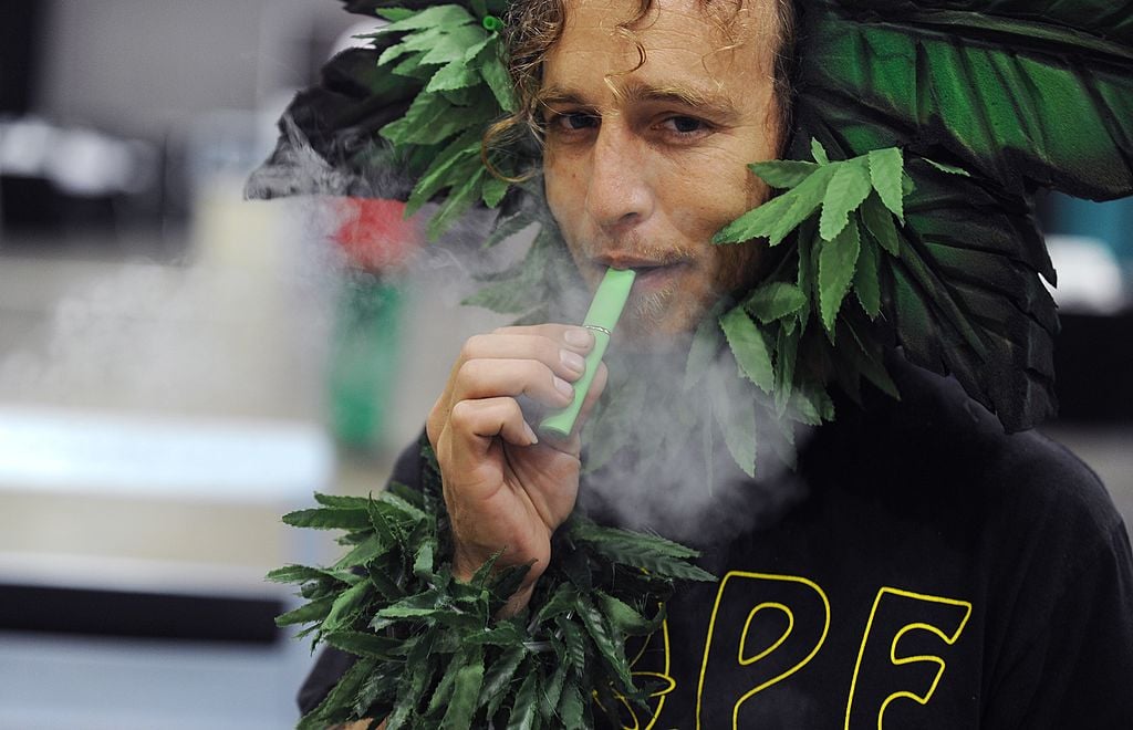 man using marijuana vaporizer