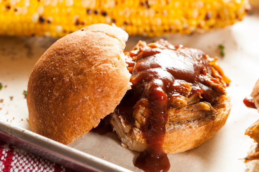 barbecue pulled pork sandwich, corn on the cob