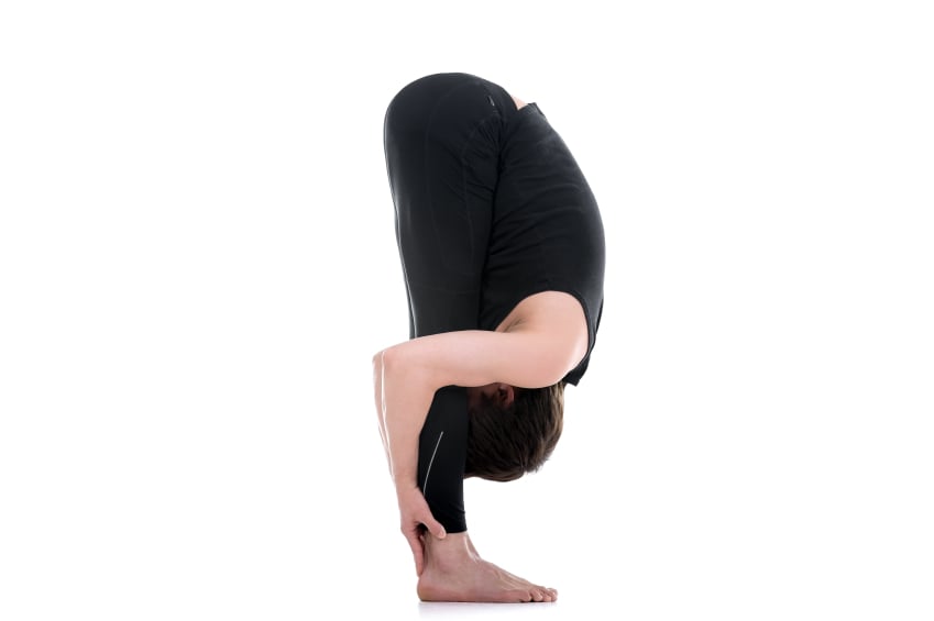 A man doing a forward bend