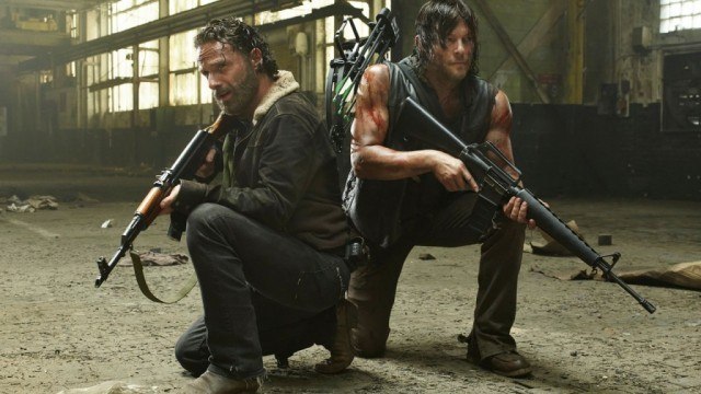 Daryl and Rick crouch holding guns Daryl and Rick crouch holding guns