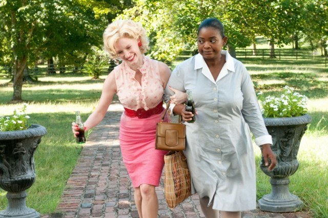 Jessica Chastain and Octavia Spencer walk arm in arm in 'The Help.'