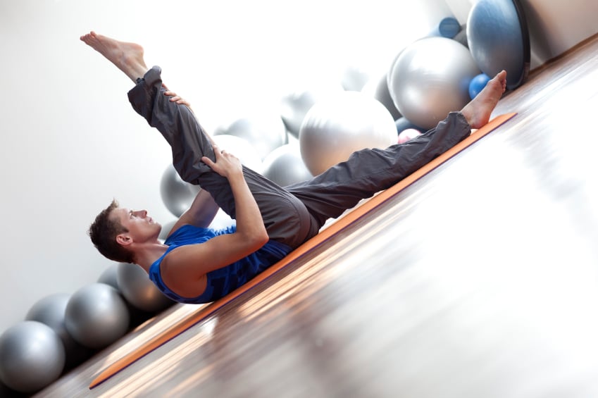 A man stretches post workout