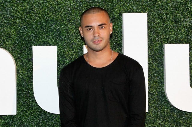 Gabriel Chavarria poses on a red carpet