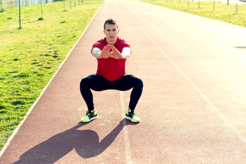 man doing squats