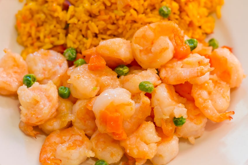 shrimp and pea stir-fry on top of rice