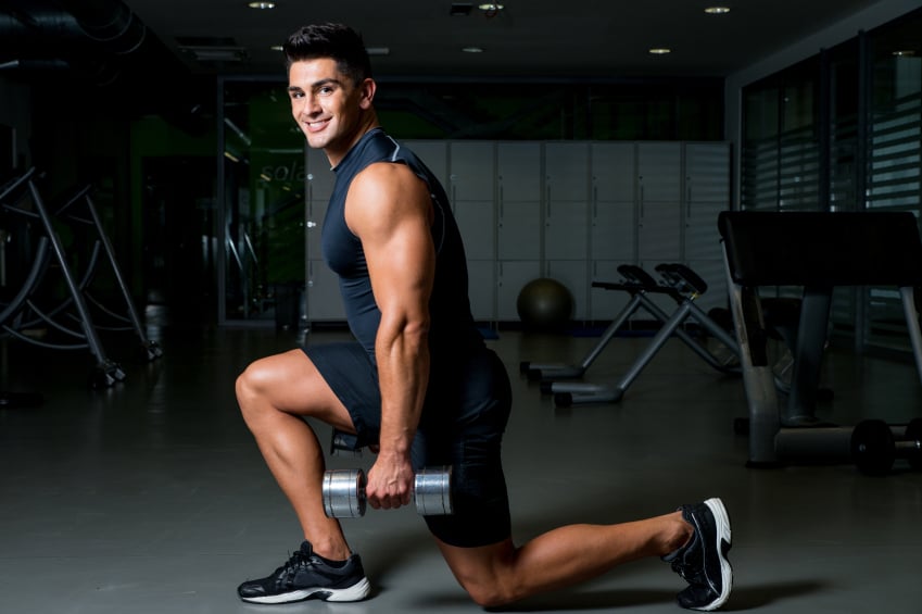 Man doing lunges with weights