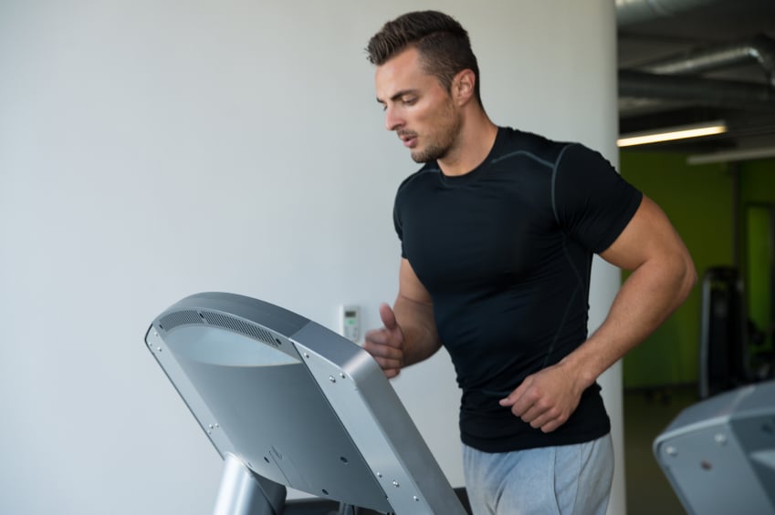 Tired man running on a treadmill Tired man running on a treadmill