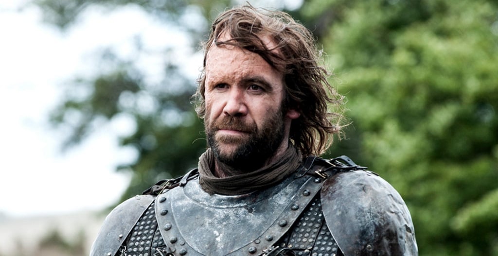 The Hound stands in his armor. The Hound stands in his armor.