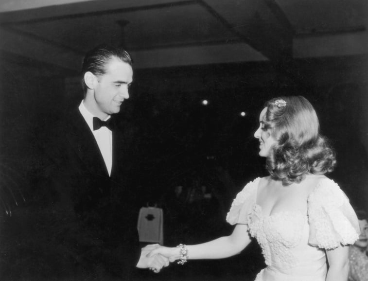 Howard Hughes shakes hands with American actress Bette Davis