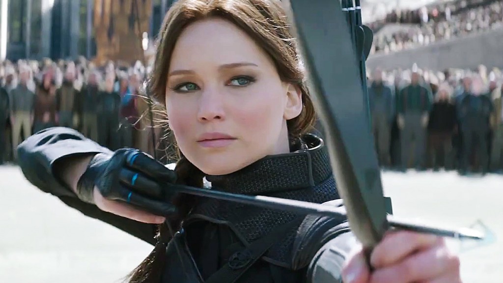This is a closeup of Katniss aiming her bow and arrow in The Hunger Games: Mockingjay.