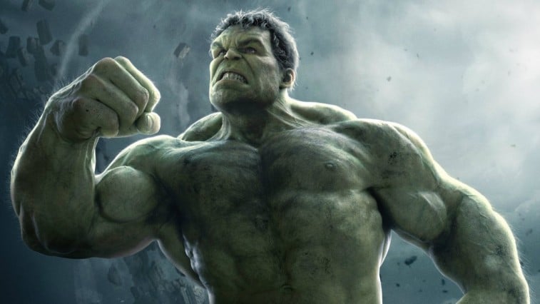 The Hulk holds up a fist while looking angry