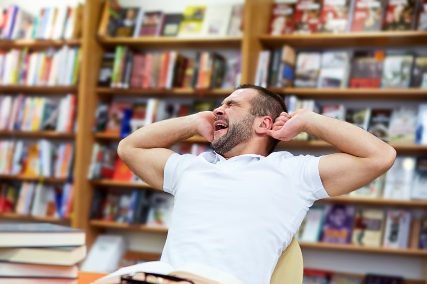 Man yawning in chair Man yawning in chair